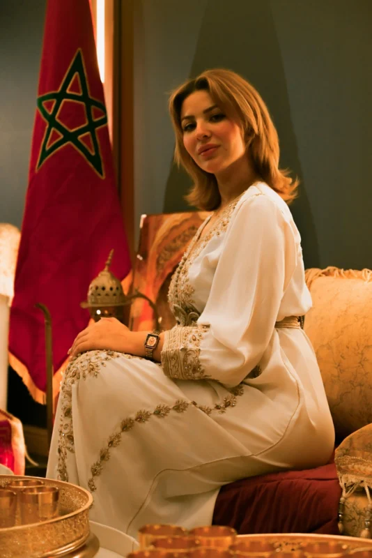 canva moroccan woman in traditional attire by flag MAGdUsS7GO8